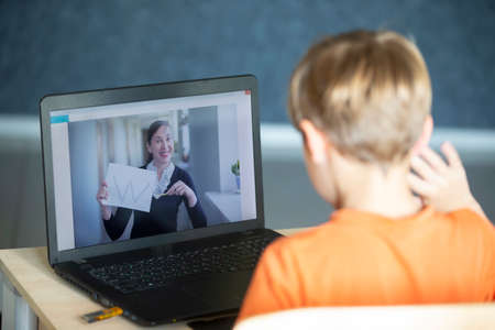 The remote teacher speaks via video link with the student. Online education and e-learning concept....