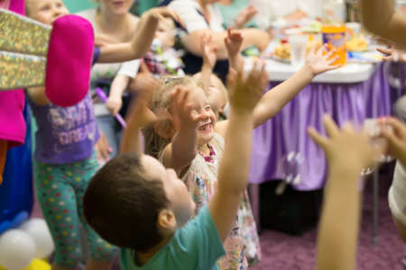 Belarus, Gomel, 189 May 2018. Children's entertainment center store. Celebrating the birthday of children.Happy beautiful children, smartly catching soap bubbles, laughing.Children's party. Fun party.Soap bubbles show.のeditorial素材