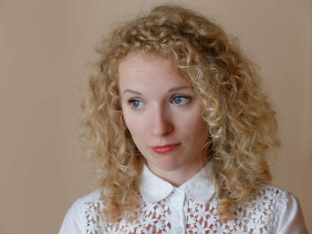 Belarus, Gomel, July 05, 2016. Central Library. Open Day.Curly blonde with blue eyes with an emotion of disappointmentのeditorial素材