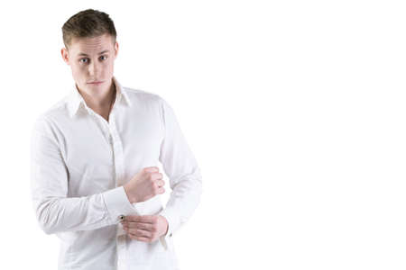 Young man in a white shirt on a white background.の写真素材