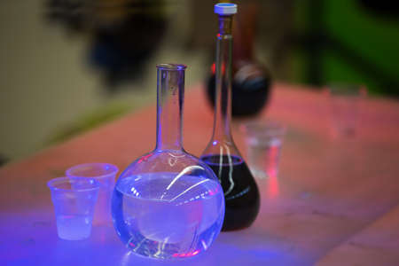 Glass bulbs in blue lighting for experiments. Test flasksの写真素材