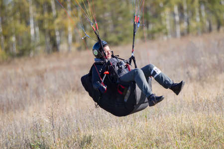 Belarus city Gomel October 7, 2018. Performances on paragliding.The paraglider landed after the flight. Parachutist on the groundのeditorial素材
