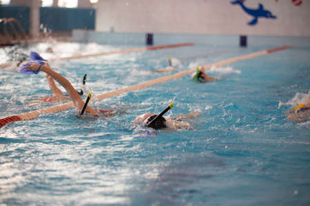 March 10, 2021. Belarus, the city of Gomel. Sportsmen swim in the pool.