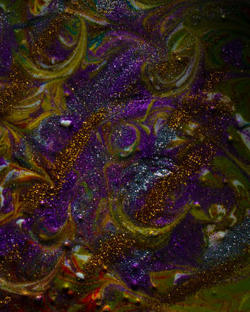 Multi-colored dark background sprinkled with purple and gold sparkles. Contemporary creativity. A...