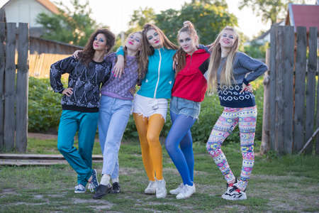 Girls in the style of the nineties. Country girls posing for the camera.の写真素材