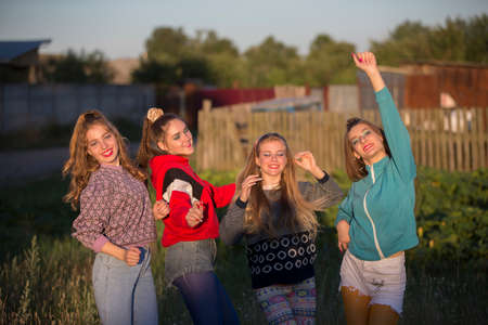 Girls in the style of the nineties. Country girls posing for the camera.の写真素材