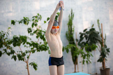 Boy in a swimming cap in the sports pool.の写真素材