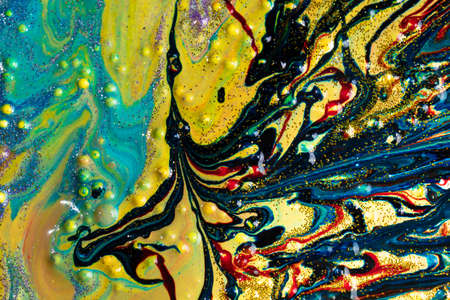 Liquid multicolored marble sprinkled with sparkles. Contemporary creativity. A colorful avant-garde...