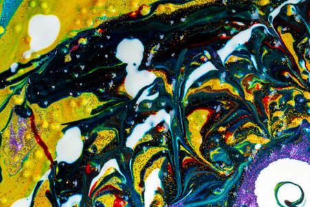 Multicolored acrylic background with dark streaks and white spots, sprinkled with glitter. Modern creativity. A colorful avant-garde painting with rich texture. A background made up of many shapes and materials.の写真素材