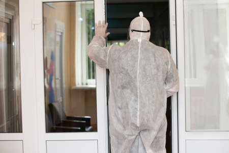 A doctor in a protective medical suit at the hospital.