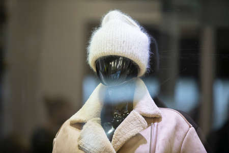 Mannequin black woman in winter clothes. Clothing sale concept.