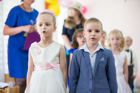 Belarus, the city of Gomil, 26.04.2019 Kindergarten in the city. Cheerful preschool children at the matinee in kindergarten.のeditorial素材