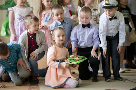 Belarus, the city of Gomil, 26.04.2019 Kindergarten in the city. Beautiful girls and boys of preschool age at the matinee in kindergarten.のeditorial素材