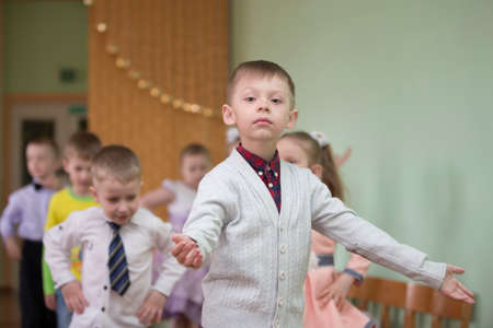 Belarus, the city of Gomil, 26.04.2019 Kindergarten in the city. Beautiful girls and boys of preschool age at the matinee in kindergarten.のeditorial素材