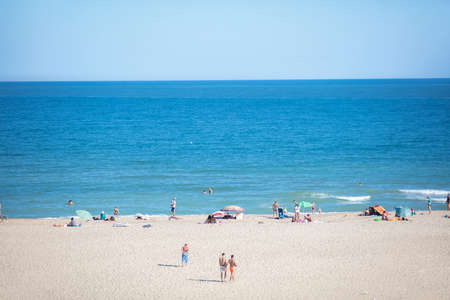 August 31, 2019. Ukratna, Odessa, beach. Sea and beach by people.のeditorial素材