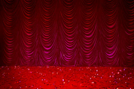 Theatrical background. Red stage curtains and sequined floor.の写真素材
