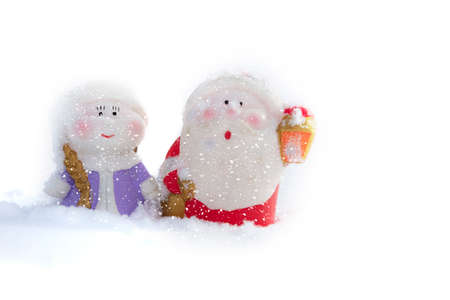 Christmas background. Funny Christmas gnomes in the white snow.