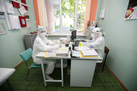 Belarus, the city of Gomil May 31, 2021 Regional hospital. Doctors in protective suits during coronavirus infection work in the emergency department.のeditorial素材