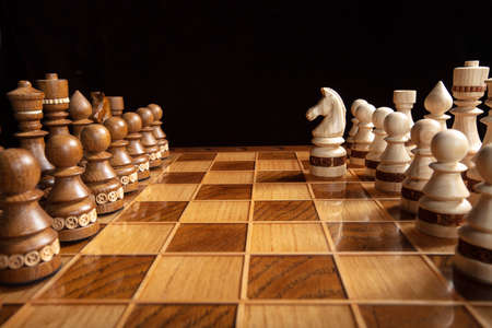 Chess on a dark background. A puzzle game with tricky combinations that requires planning and...