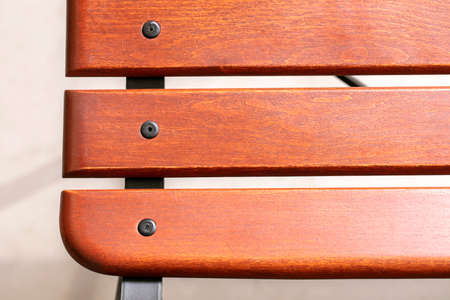 Part of a wooden bench in the form of polished boards.の写真素材