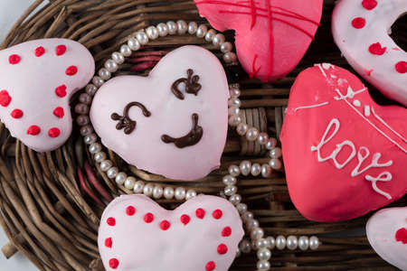 Beautiful pink gingerbread or heart shaped cookies. Sweet edible valentine's day gift.