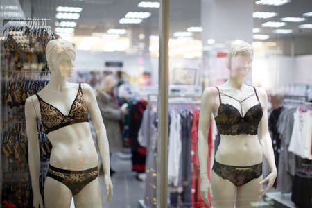 Mannequins of women in underwear in a shop window. Sale of underwear.の写真素材