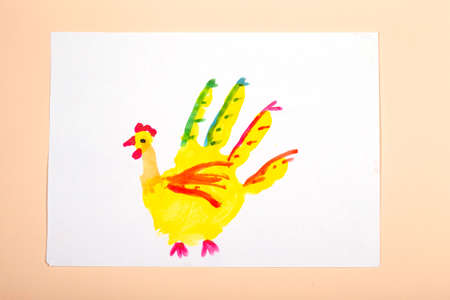 Children's drawing. Application of children's creativity. Kindergarten and craft school. The child drew a chicken with his fingers.の写真素材