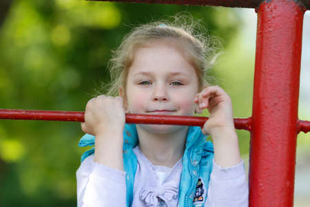 Belarus, the city of Gomil, May 16, 2016. Kindergarten. Little girl playing outdoors.のeditorial素材