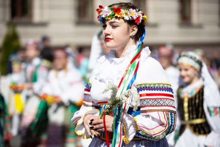 Belarus, Gomil 09.05.2021. Holiday in the city. A number of girls in national costumes with a wreath on their heads.のeditorial素材