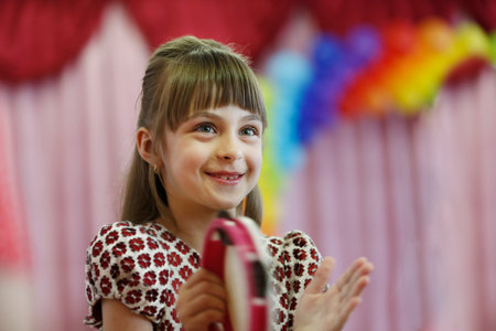 Belarus, city of Gomil, May 16, 2019. Morning in kindergarten.Portrait of a happy little girl at a children's party.のeditorial素材