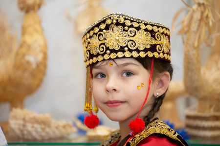 Belarus, city of Gomel, May 21, 2021 Children's holiday in the city. A little girl in the Uzbek national headdress.のeditorial素材