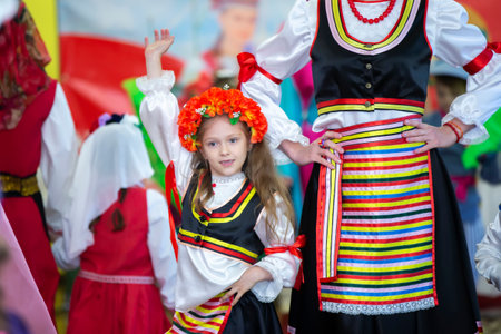 Belarus, city of Gomel, May 21, 2021 Children's holiday in the city. A little girl in a Ukrainian costume is dancing.のeditorial素材