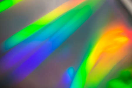 Rainbow holographic bokeh background. Multicolored overflows of color.