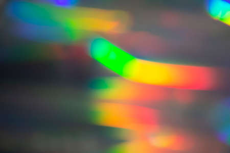 Rainbow holographic bokeh background. Multicolored overflows of color.