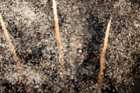 On a black background bokeh from explosions of colorful fireworks.
