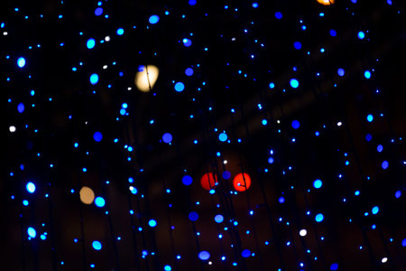 Multi-colored spots of lights from Christmas decorations.の写真素材