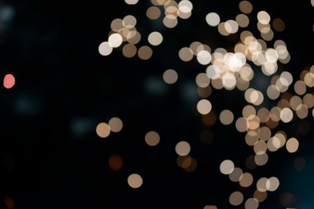 On a black background bokeh from explosions of colorful fireworks.