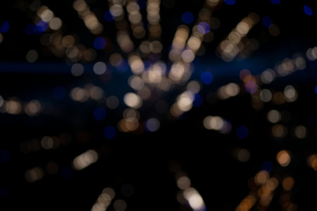On a black background bokeh from explosions of colorful fireworks.の写真素材