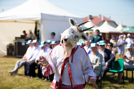 31 07 2021 Belarus, Avtyuki village. Festival of ethnic cultures. A man in a Slavic ethnic ritual costume of a goat.のeditorial素材