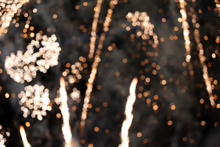 On a black background bokeh from explosions of colorful fireworks.の写真素材