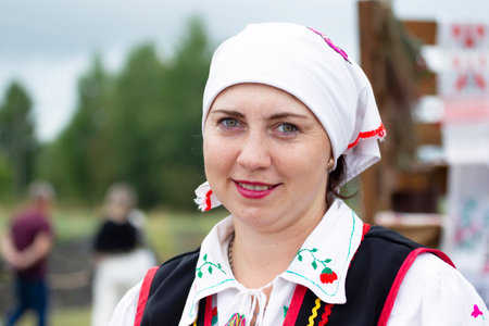 August 20, 2022.Belarus, the village of Lyaskovichi. Holiday of Belarusian culture. Portrait of a Belarusian woman in national clothes.のeditorial素材