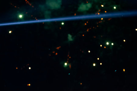 On a black background bokeh from explosions of colorful fireworks.の写真素材