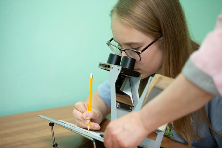 Belarus, Chonka village, May 31, 2021. Children's eye hospital. Optometrist and teenager. Treatment of vision problems in children.の写真素材