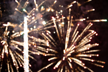 On a black background bokeh from explosions of colorful fireworks.の写真素材