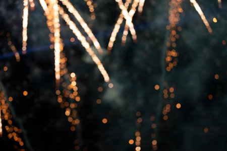 On a black background bokeh from explosions of colorful fireworks.の写真素材