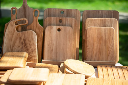 Wooden kitchen cutting boards for sale at the fair.の写真素材