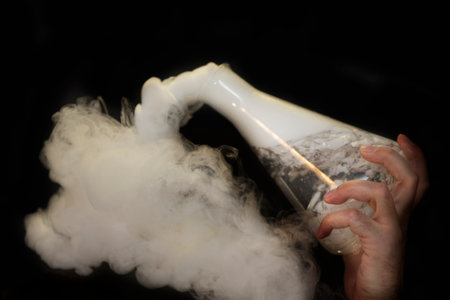 Glass flask with puffs of smoke as a result of liquid nitrogen reaction.の写真素材