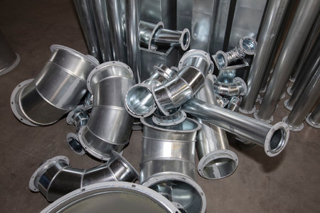 Metal stainless ventilation pipes at a metallurgical plant. Rolled metal.の写真素材