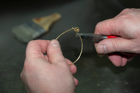 Jewelry master at work on the manufacture of a gold ring. Jewelry factory.の写真素材