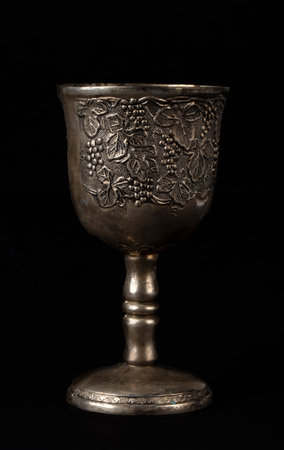 Antique silver royal goblet with grape engraving.の写真素材